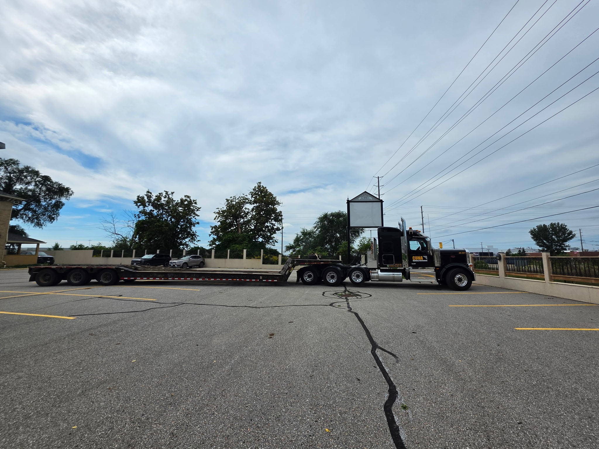 Float truck staged for heavy haul of railway machines and materials