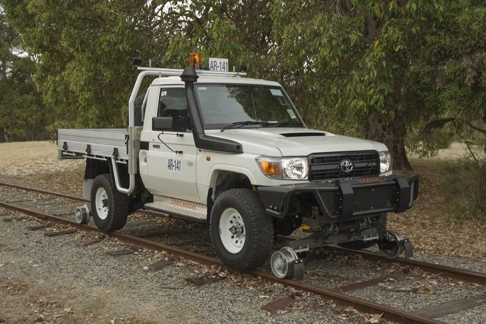 Pickup with hi-rail gear on standard-gauge track