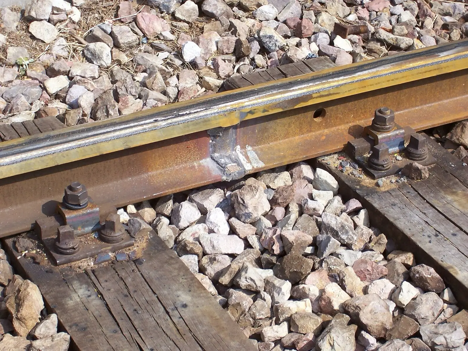 Finished thermite weld in a rail head after grinding